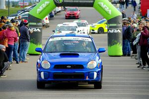 Jimmy Pelizzari / Kate Stevens Subaru WRX leaves the ceremonial start.