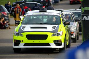 Tim Rooney / Claudia Barbera-Pullen Subaru WRX STi leaves the ceremonial start.