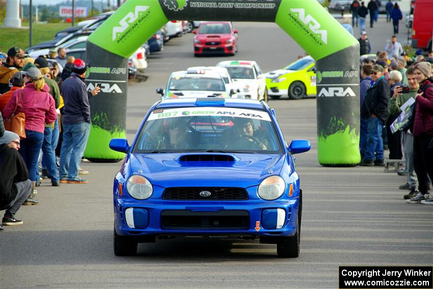 Jimmy Pelizzari / Kate Stevens Subaru WRX leaves the ceremonial start.