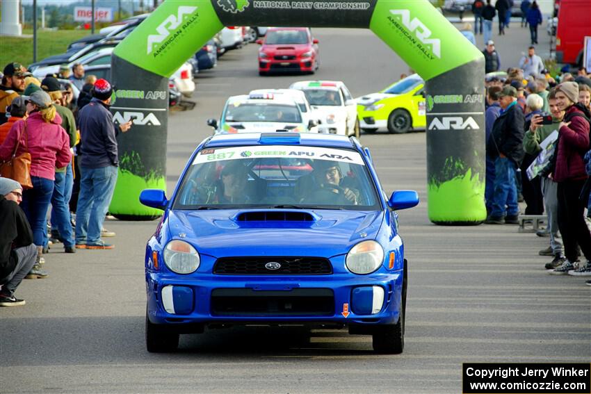 Jimmy Pelizzari / Kate Stevens Subaru WRX leaves the ceremonial start.