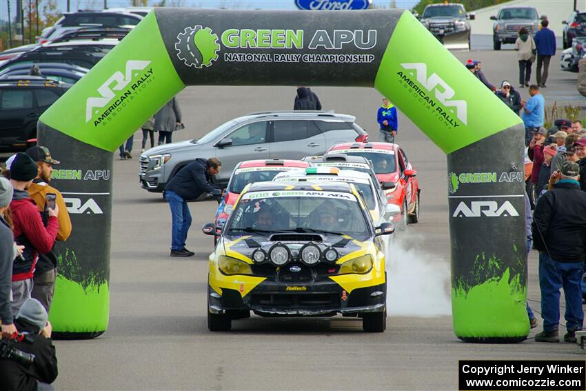 Colin Schulz / Jake Carlson Subaru WRX STi leaves the ceremonial start.