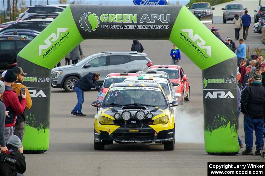 Colin Schulz / Jake Carlson Subaru WRX STi leaves the ceremonial start.