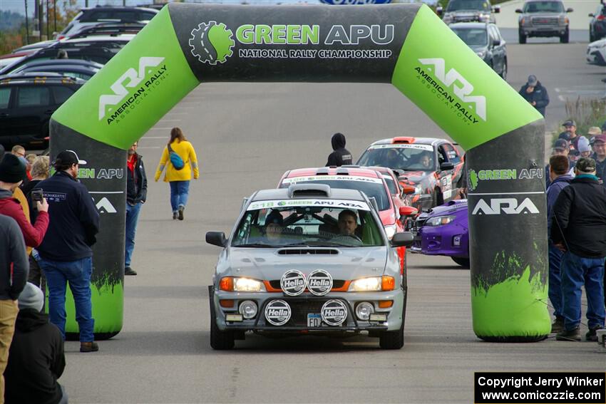 Nick Morris / Josh Kemp Subaru Impreza leaves the ceremonial start.