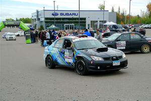 Matt James / Jackie James Subaru Impreza leaves the ceremonial start.