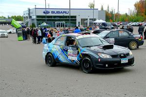 Matt James / Jackie James Subaru Impreza leaves the ceremonial start.