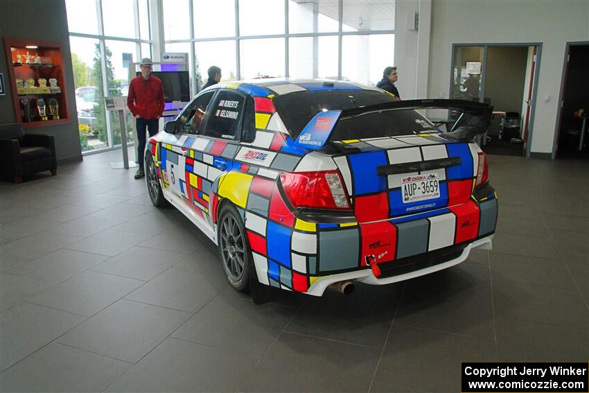 The former Nick Roberts / Rhianon Gelsomino Subaru WRX STi on display inside Fox Marquette Subaru.