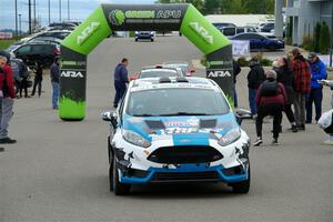 Alastair Scully / Alison LaRoza Ford Fiesta ST leaves the ceremonial start.