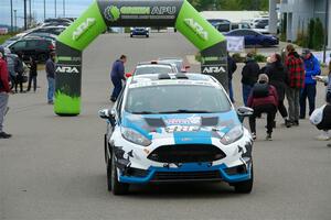 Alastair Scully / Alison LaRoza Ford Fiesta ST leaves the ceremonial start.