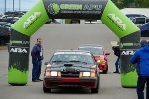 Neil CarlinSchauer / Tim Kohlmann Ford Mustang SVO leaves the ceremonial start.