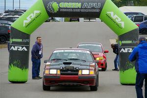 Neil CarlinSchauer / Tim Kohlmann Ford Mustang SVO leaves the ceremonial start.