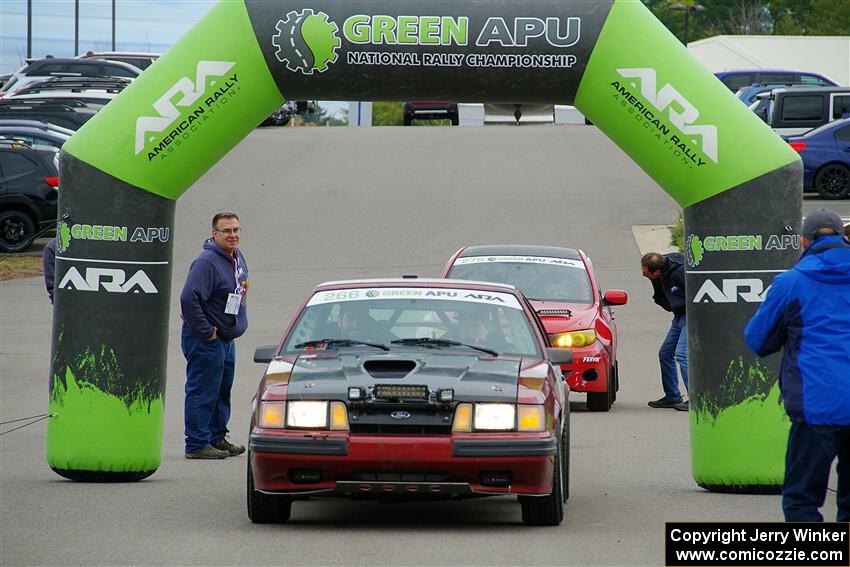 Neil CarlinSchauer / Tim Kohlmann Ford Mustang SVO leaves the ceremonial start.