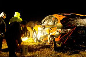 Grzegorz Bugaj / Ela Dziubanski Subaru WRX STi is cleaned at Sidnaw service after day one.