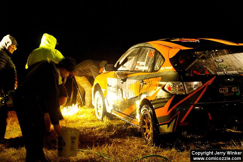 Grzegorz Bugaj / Ela Dziubanski Subaru WRX STi is cleaned at Sidnaw service after day one.