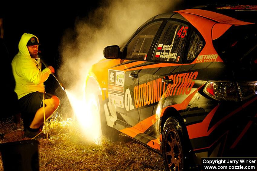 Grzegorz Bugaj / Ela Dziubanski Subaru WRX STi is cleaned at Sidnaw service after day one.