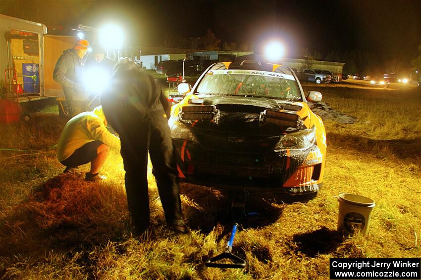 Grzegorz Bugaj / Ela Dziubanski Subaru WRX STi is cleaned at Sidnaw service after day one.