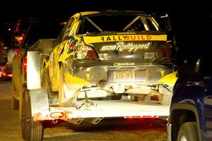 After rolling, a heavily damaged Colin Schulz / Jake Carlson Subaru WRX STi leaves Sidnaw service.