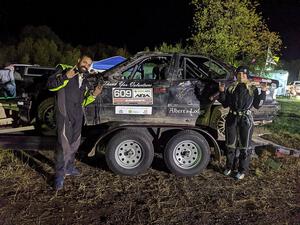 Keenan Phillips / Salina Melotti BMW 328i at Sidnaw service after rolling hard on day one.