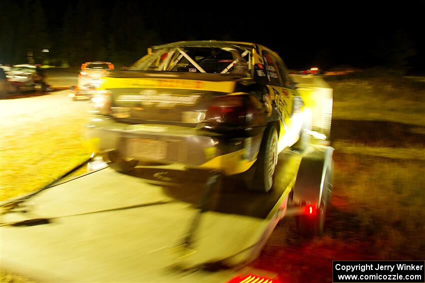 After rolling, a heavily damaged Colin Schulz / Jake Carlson Subaru WRX STi leaves Sidnaw service.