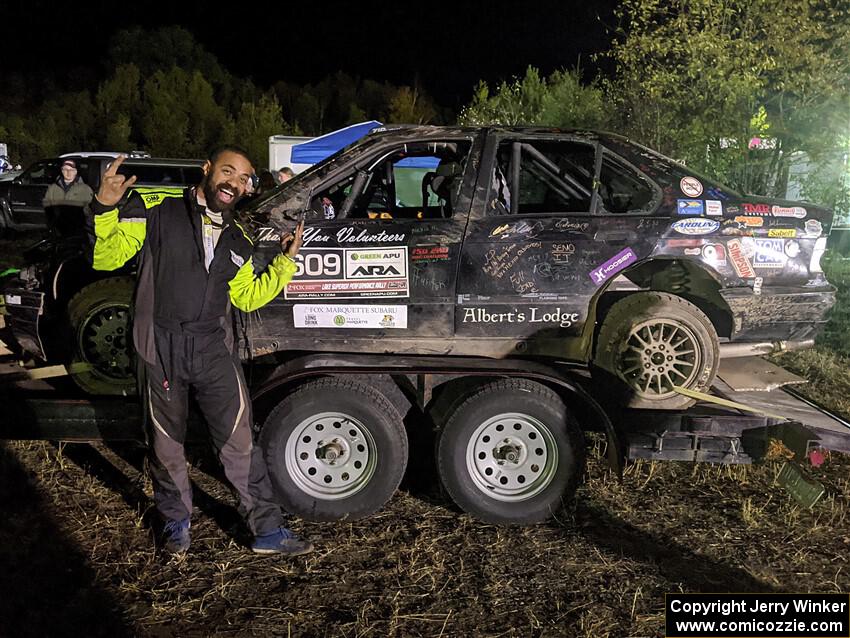 Keenan Phillips / Salina Melotti BMW 328i at Sidnaw service after rolling hard on day one.