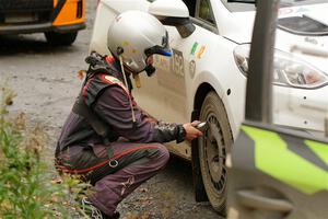 K.J. Miller checks tires before SS15, Double Trouble, on the Ford Fiesta Rally3 he and Javier Olivares shared.