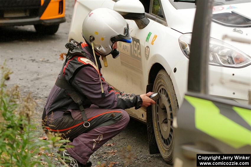 K.J. Miller checks tires before SS15, Double Trouble, on the Ford Fiesta Rally3 he and Javier Olivares shared.