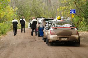 The lineup to the start of SS16, Mount Marquette, with Jason Cook / Maggie Tu Subaru WRX at the end.