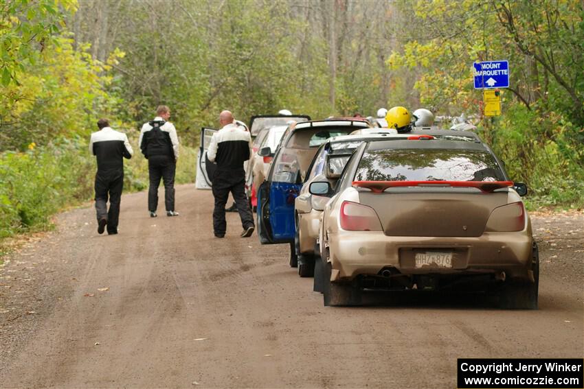 The lineup to the start of SS16, Mount Marquette, with Jason Cook / Maggie Tu Subaru WRX at the end.