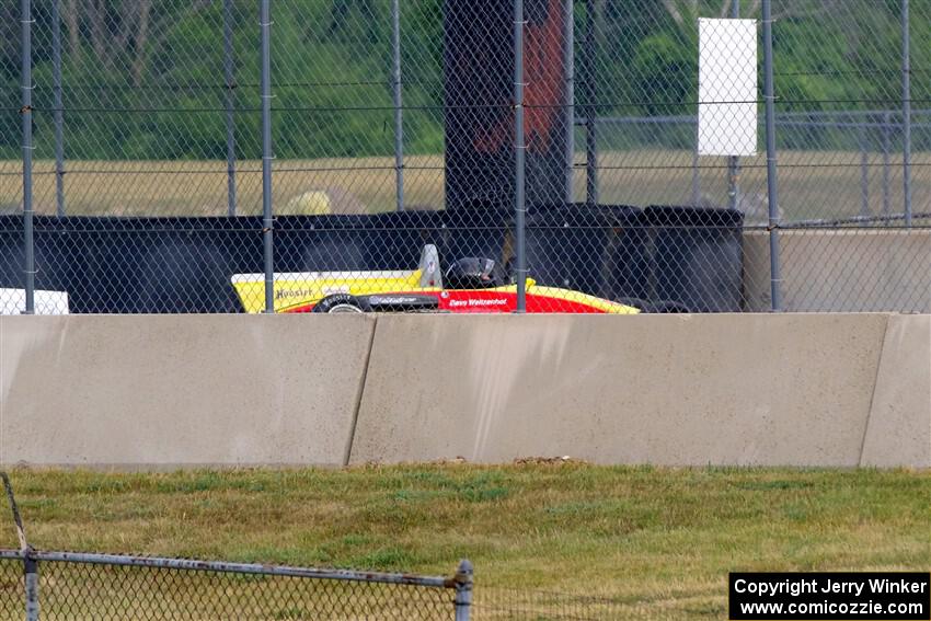 Dave Weitzenhof's Citation 95SFZ hits the wall hard at turn 13.