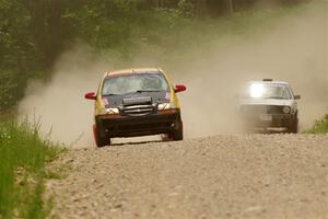 James Walker / Yannis Burnell Chevy Aveo and Josh Nykanen / Connor Himes VW GTI on SS1, Camp 3 North.