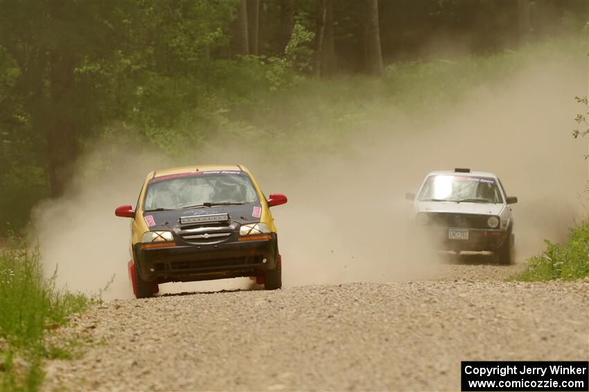 James Walker / Yannis Burnell Chevy Aveo and Josh Nykanen / Connor Himes VW GTI on SS1, Camp 3 North.