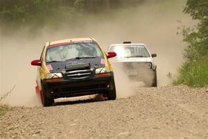 James Walker / Yannis Burnell Chevy Aveo and Josh Nykanen / Connor Himes VW GTI on SS1, Camp 3 North.