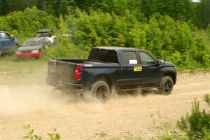 A Chevy Silverado pickup sweeps SS3, Woodtick Hollow.