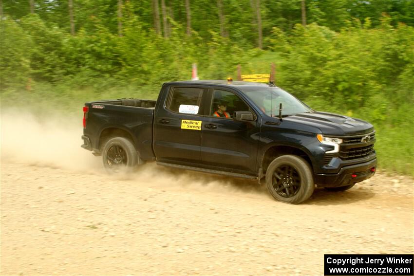 A Chevy Silverado pickup sweeps SS3, Woodtick Hollow.