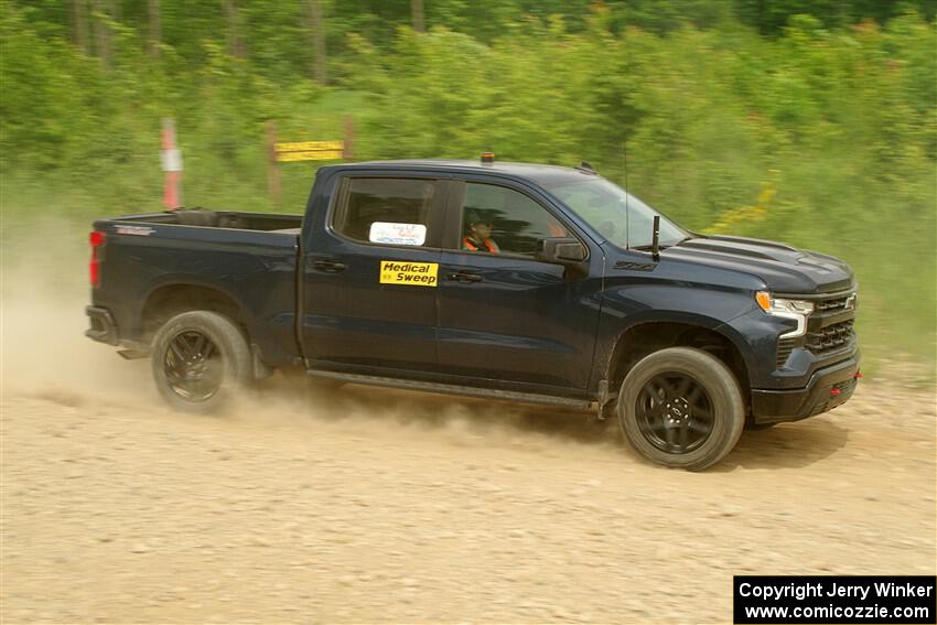 A Chevy Silverado pickup sweeps SS3, Woodtick Hollow.