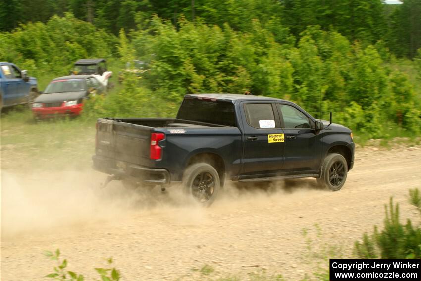 A Chevy Silverado pickup sweeps SS3, Woodtick Hollow.