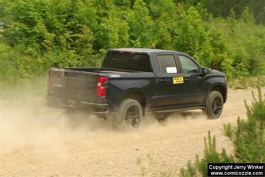 A Chevy Silverado pickup sweeps SS3, Woodtick Hollow.