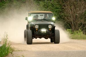 A Jeep Wrangler sweeps SS6, Camp 3 South.