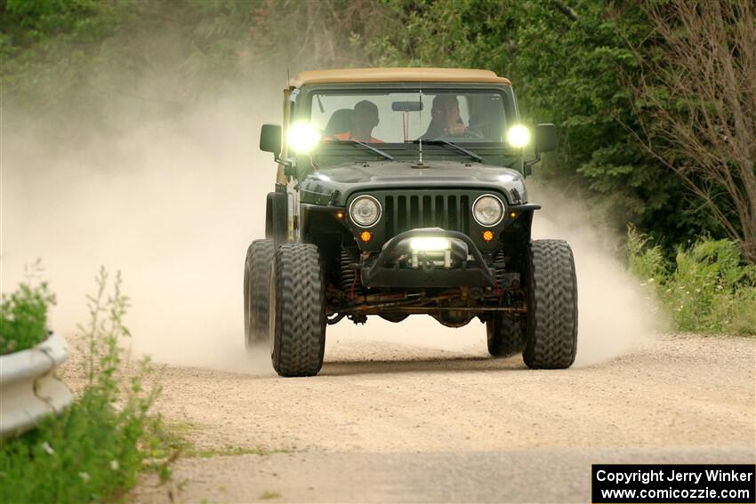 A Jeep Wrangler sweeps SS6, Camp 3 South.