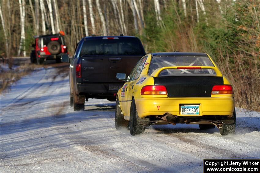 Steve Gingras / Katie Gingras Subaru Impreza is towed out of SS2, Nemadji Trail West, after DNF'ing.