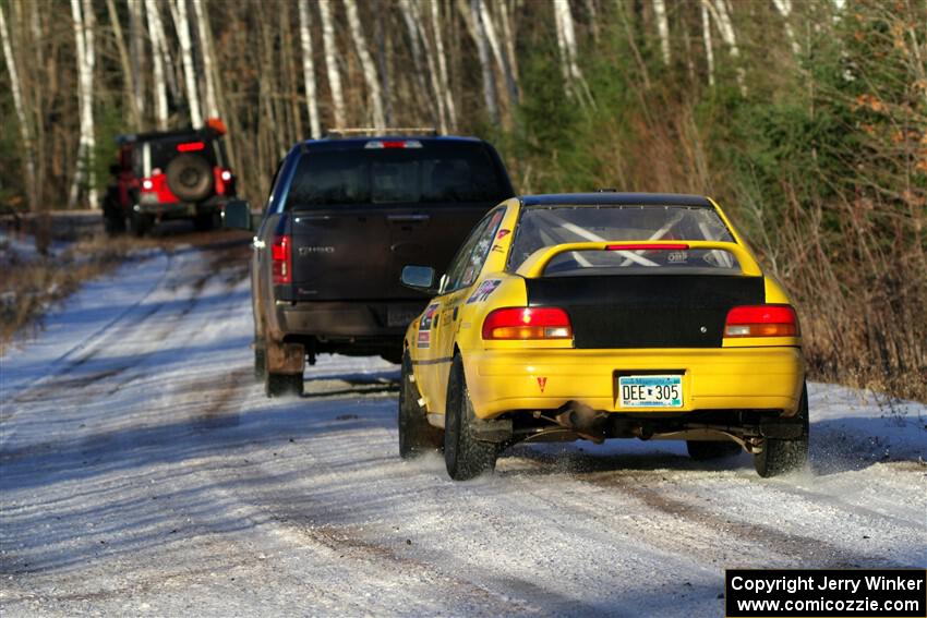 Steve Gingras / Katie Gingras Subaru Impreza is towed out of SS2, Nemadji Trail West, after DNF'ing.