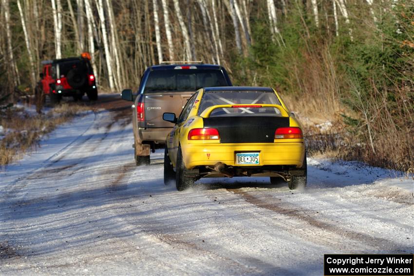 Steve Gingras / Katie Gingras Subaru Impreza is towed out of SS2, Nemadji Trail West, after DNF'ing.