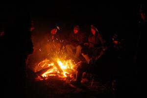 Marshals and workers keep warm by a campfire before SS15, Camp 30-East Branch II.