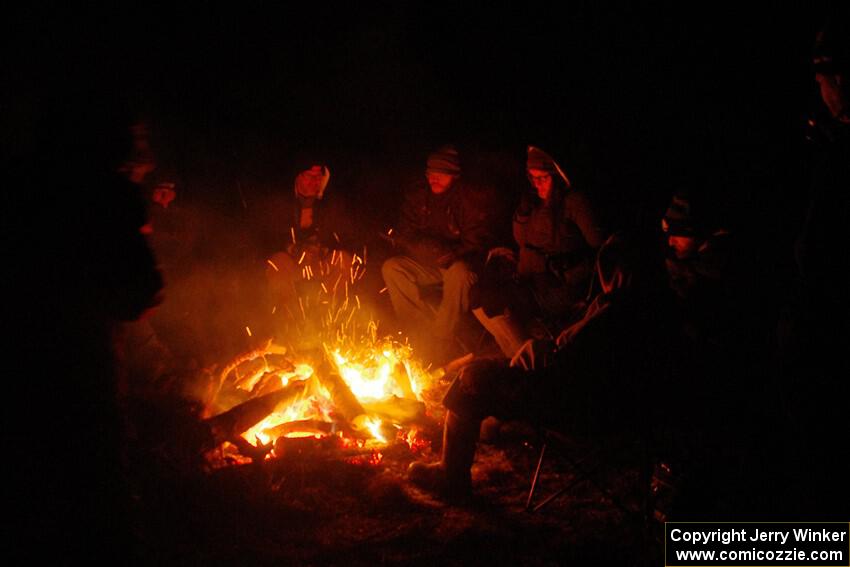 Marshals and workers keep warm by a campfire before SS15, Camp 30-East Branch II.