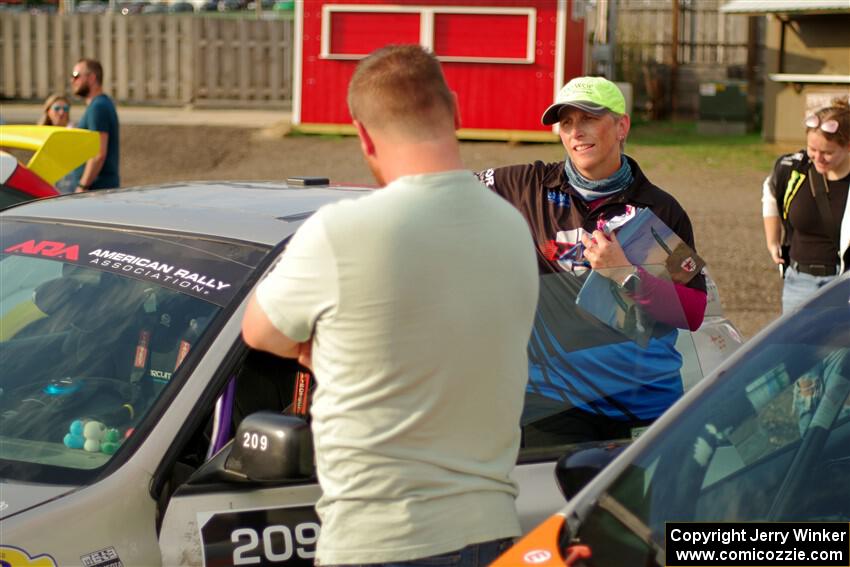 Kristen Tabor chats in front of the Madelyn Tabor / Sophia McKee Subaru Impreza 2.5RS at parc expose.