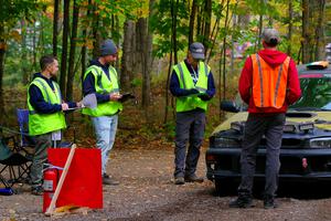 The start crew and Sean Costello / Steve Blomquist-Scanlan Subaru Impreza 2.5RS prepares for the start of SS16, Mount Marquette.