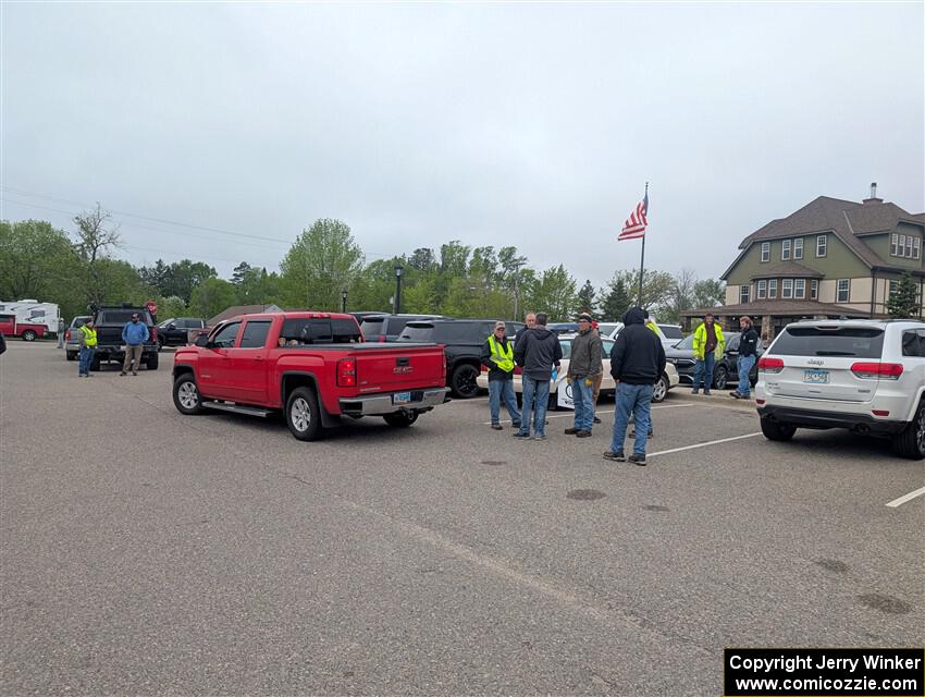Stage crews gather in the parking lot before the event.