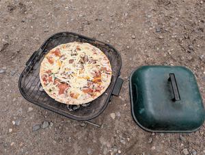 Grilling pizza between stages.