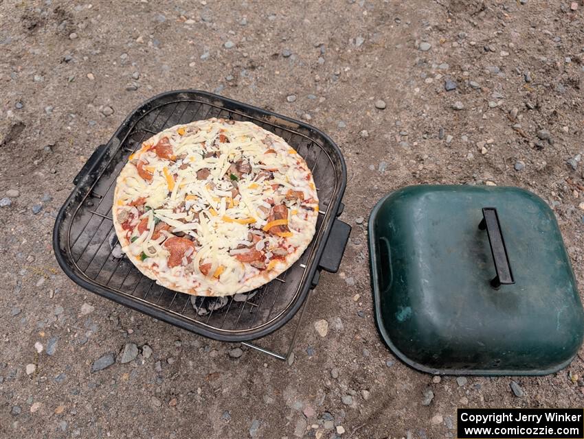 Grilling pizza between stages.