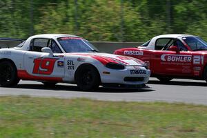 Nolan Elder's STL Mazda Miata passes Andrew Jenkins' Spec Miata Mazda Miata