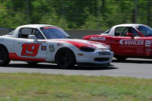 Nolan Elder's STL Mazda Miata passes Andrew Jenkins' Spec Miata Mazda Miata